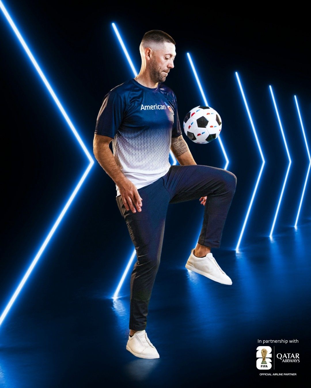 Clint Dempsey juggling a soccer ball in a studio set